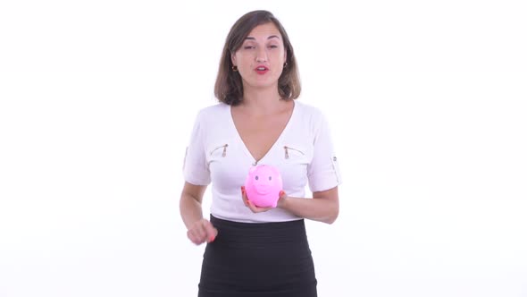 Happy Beautiful Businesswoman Holding Piggy Bank and Giving Thumbs Up