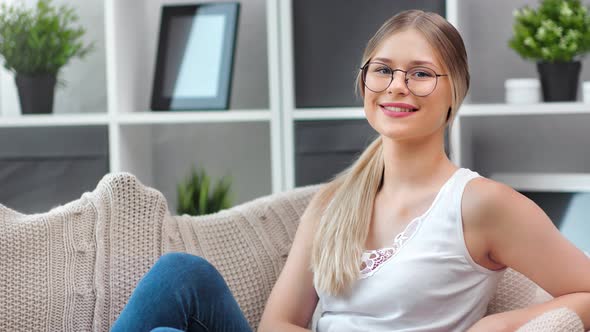 Pretty Young Female in Glasses Smiling Open Mouth Showing Healthy Teeth Posing Looking at Camera