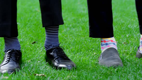 Groom and groomsmen showing there shoes 4K 4k