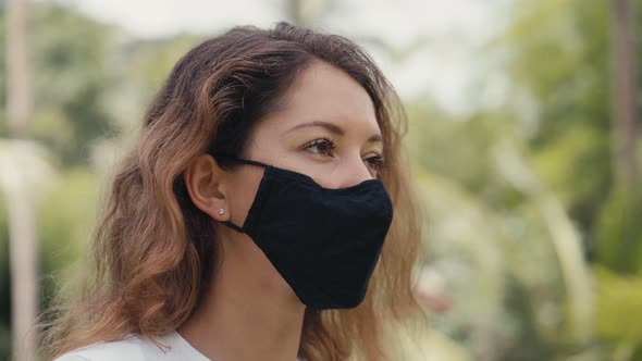 Revolving Around a Young Woman Takes Off Her Medical Mask