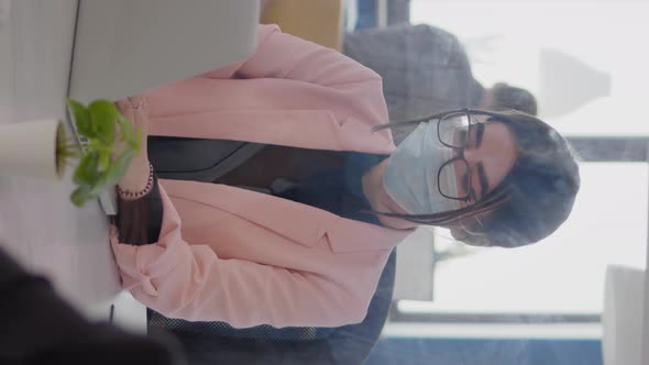 Vertical Video Portrait of Business Woman with Protection Face Mask Working on Laptop Computer