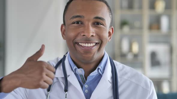 Thumbs Up By Smiling Confident AfricanAmerican Doctor