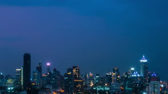 Time lapse night cityscape and high-rise buildings in metropolis city center