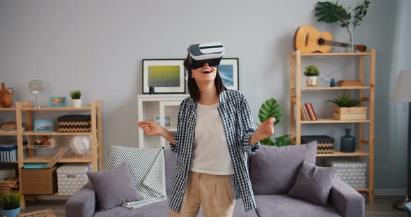 Slow Motion of Happy Woman Dancing in Augmented Reality Glasses Having Fun