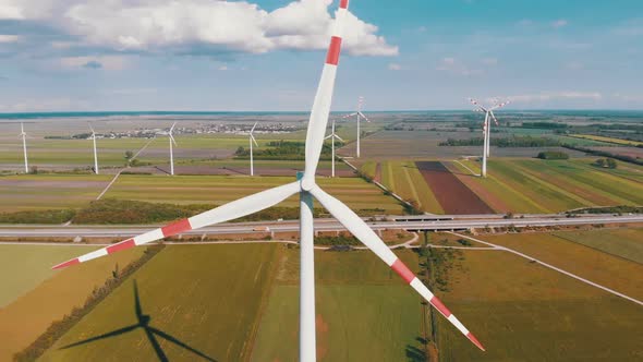 Aerial View of Wind Turbines Farm and Agricultural Fields. Austria