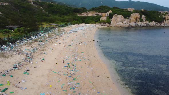 Eyesore as marine trash litters nice sandy beach in Vietnam; aerial