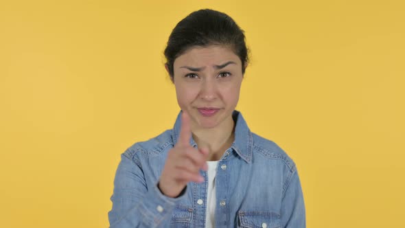 Indian Woman No Sign By Finger, Yellow Background 