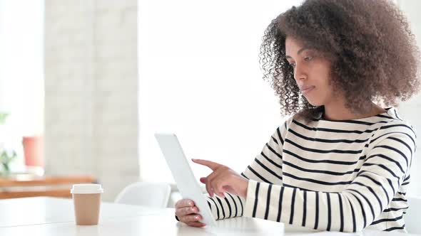 African Woman Using Tablet, Browsing Internet