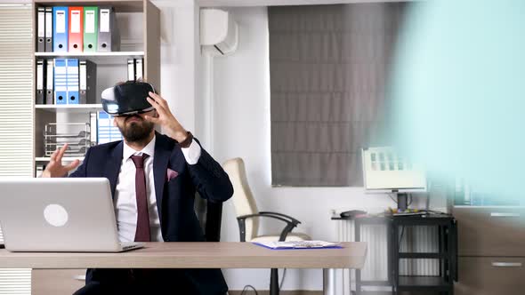 Man in Business Suit Wearing a VR Headset