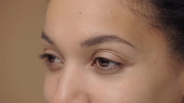 Brown Female Eyes Look Seriously to the Side