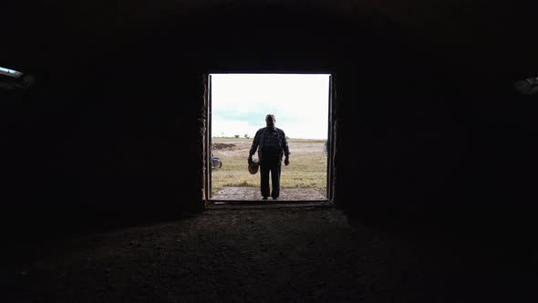 Desperate farmer near an empty barn.  World economic crisis