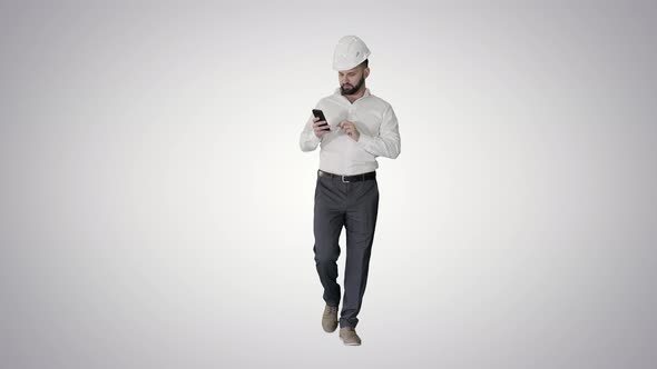 Engineer Walking and Using Smartphone on Gradient Background