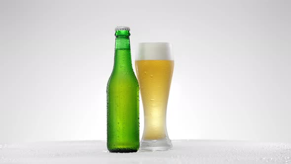 Glass of Beer with a Bottle of Beer