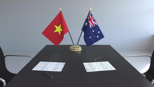 Flags of Vietnam and Australia on the Table