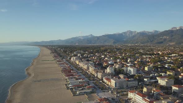 Italian Town of Lido di Camaiore kissed by the Sunset with Tuscan Coast and Hills on the background