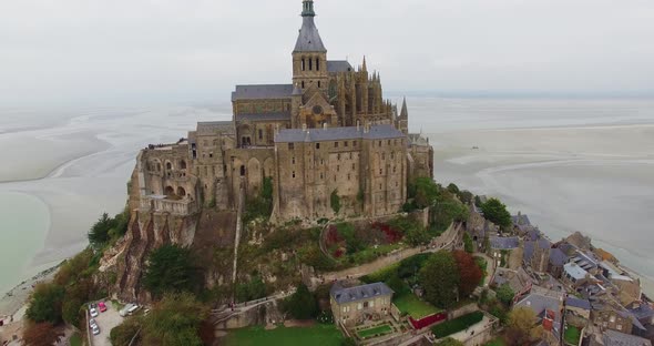 French Castle on a small island in France Le Mont Saint Michel Drone Shot In Normandy Typical Gothic