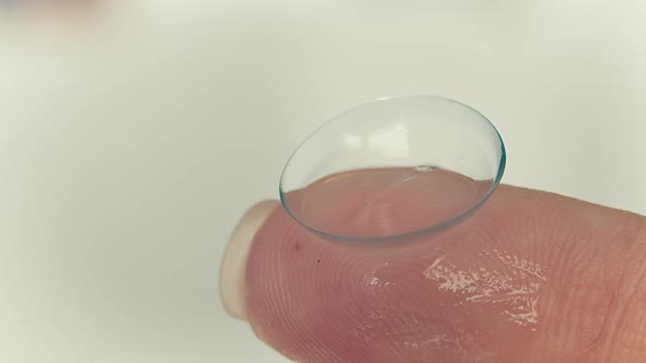 Close Up of Soft Contact Lens Torn on the Finger
