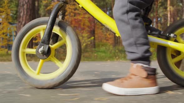 Close Up of Unrecognizable Kid on Balance Bike