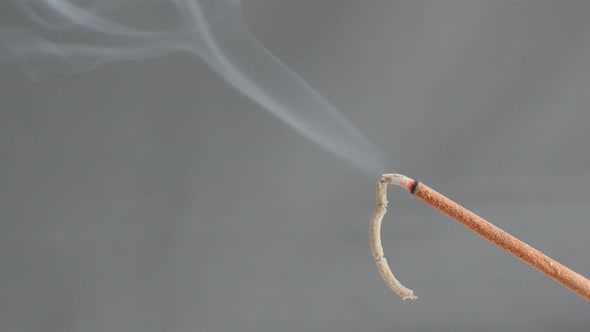 Close-up of aromatic biotic material burning for meditation purpose 4K 2160p 30fps UltraHD footage - alt