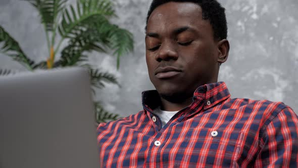 Close Up Adult African American Man Works for Laptop Typing Text on Keyboard