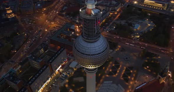 AERIAL: Night Hyperlapse, Motion Time Lapse of Berlin TV Tower Alexanderplatz with Beautiful City