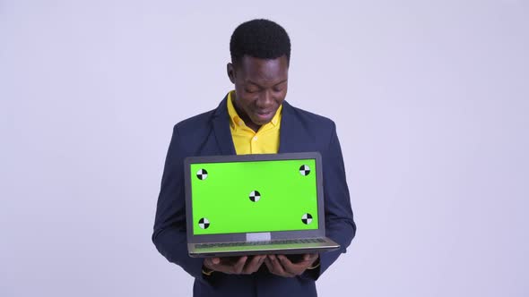 Young Happy African Businessman Explaining While Showing Laptop