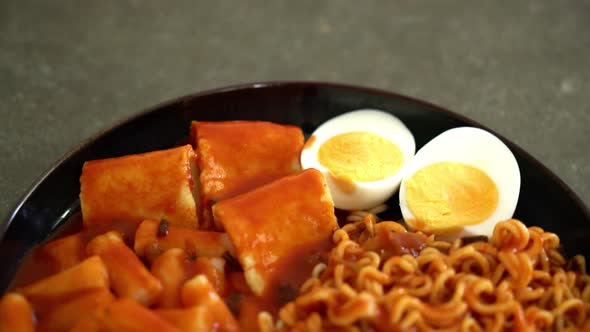 Korean instant noodles with Korean rice cake and fish cake and boiled egg - Rabokki - Korean food st