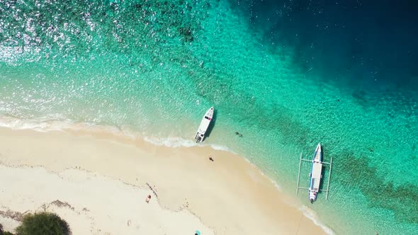 Aerial drone travel of relaxing seashore beach lifestyle by blue green ocean and white sand backgrou