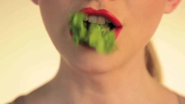 Woman eating lettuce