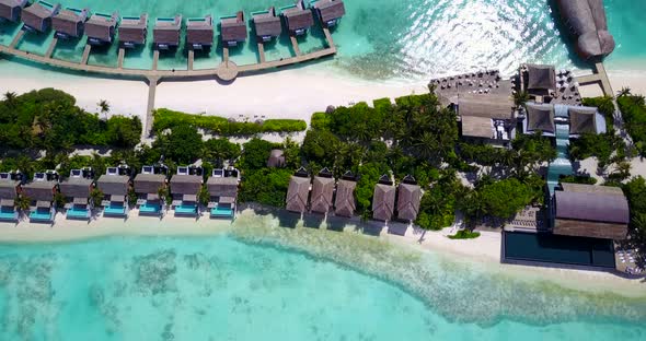Luxury overhead clean view of a sandy white paradise beach and turquoise sea background 