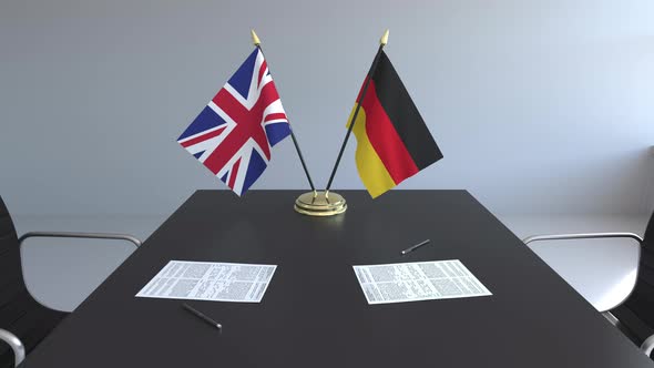 Flags of Great Britain and Germany on the Table alt