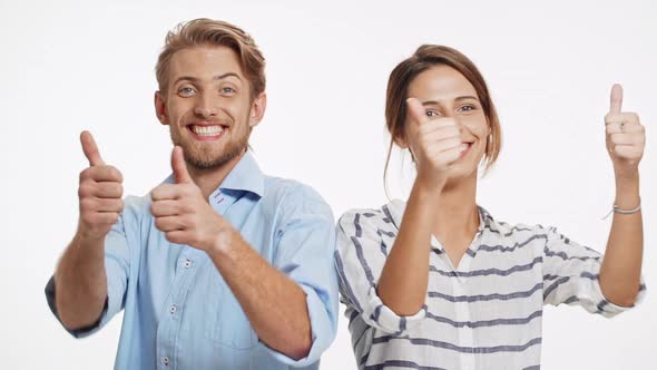 Successful Caucasian Couple Standing Back to Back on White Background