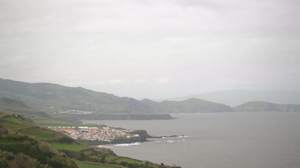 shot of a small town near the ocean in azores