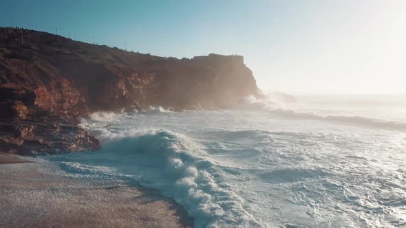 Stormy water of Atlantic Ocean, beautiful coastline, the crest of the wave crushing on the shore