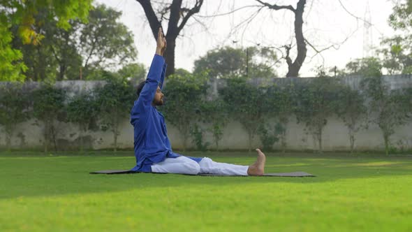 Indian man doing yoga at morning time