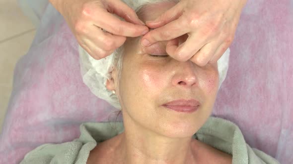 Mature Woman Having Facial Massage