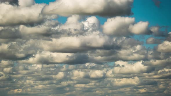 Cumulus Cirrus Clouds Move in the Blue Sky. Time Lapse.