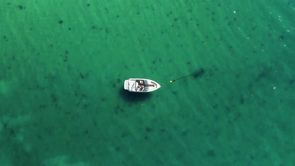 Aerial View of a Fisher on a White Drifting Boat