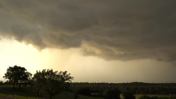 Clouds moving through the sky during severe thunderstorm in Oklahoma at sunset