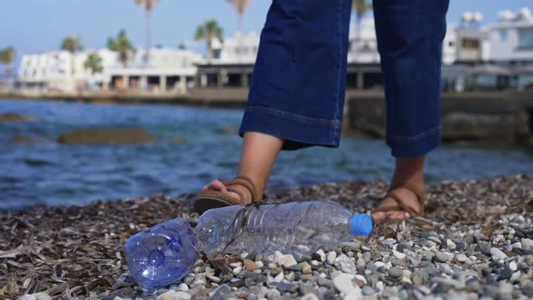 Unrecognizable Young Woman Picking Garbage on Mediterranean Sea Coast Leaving in Slow Motion