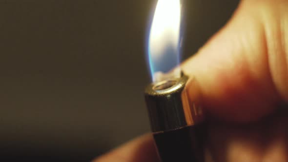 Close Up Slow Motion Shot of Lighter on the Man Hand