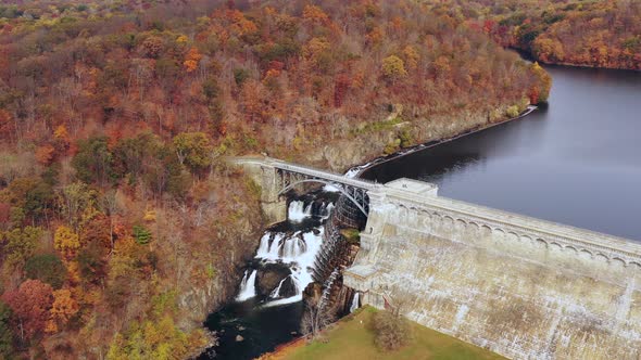aerial dolly in to the waterfalls & dam wall. Then camera tilts down over falls & overpass. The maso