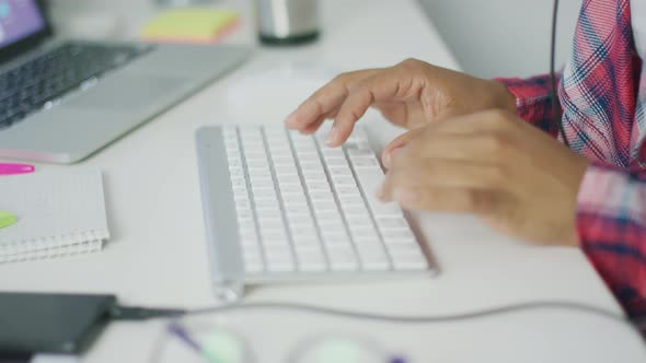 Crop Worker Typing on Keyboard