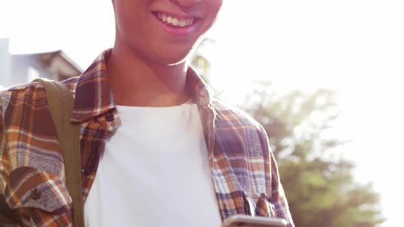 A man texting and laughing