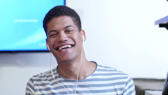 Black Young Man Listening Music and Dancing