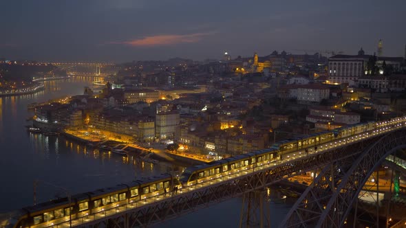 Flexity Outlook Eurotram Trains of the Porto Metro Meets on Dom Luis I Bridge. Night Shot After