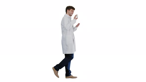 Smiling Male Doctor with Stethoscope Walking and Advertising Pills on White Background