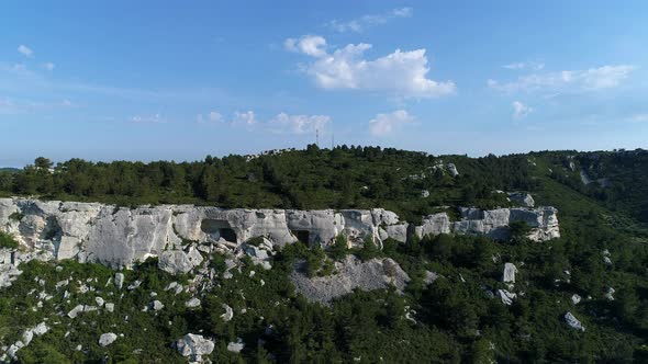 Cave dwellings of the Alpilles massif in France seen from the sky