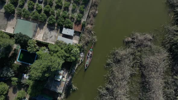 Top to Down Aerial Drone Footage of a Boat with Tourists on It to Visit the Natural Park of the