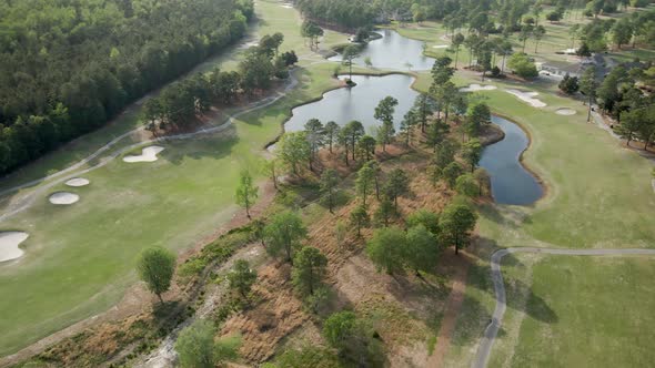 Magnolia Greens Golf Course aerial high above orbiting